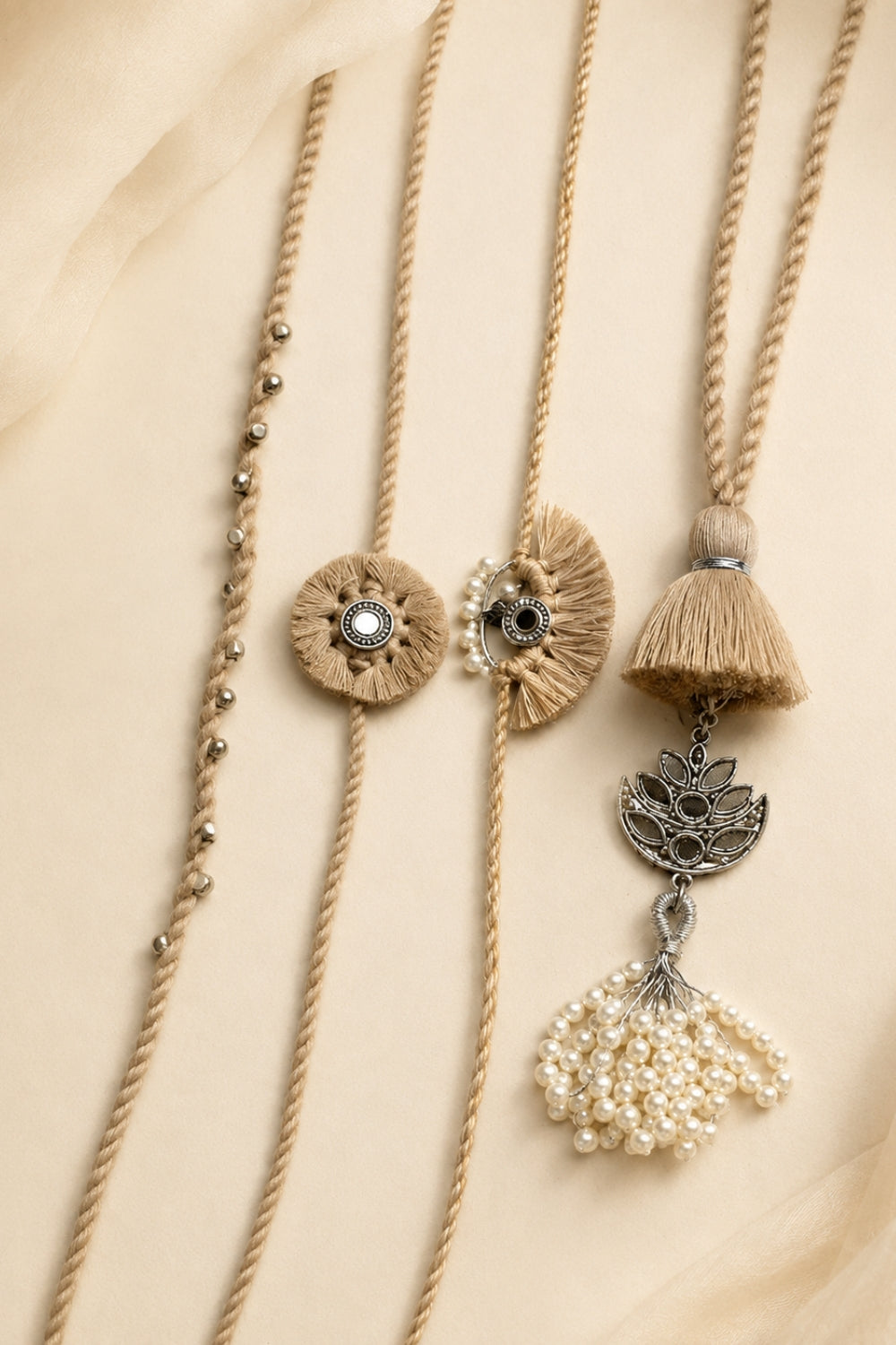 Beige Rakhi & Lumba Set (4 Pieces)