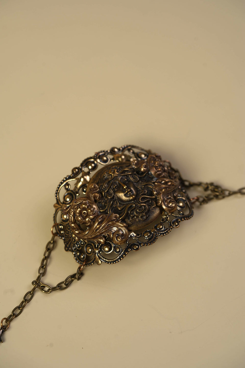 Victorian Brass Hand Cuff with Repousse Classical Face & Filigree Scrollwork